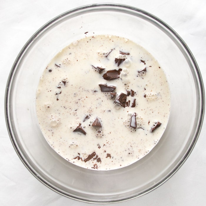 Hot cream poured over chocolate to make ganache