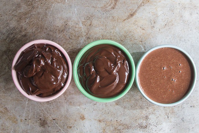 Three bowls of ganache, 1 bowl with 2:1 ratio, 1 bowl with 1:1 ratio, and 1 bowl with 1:1.5 ratio