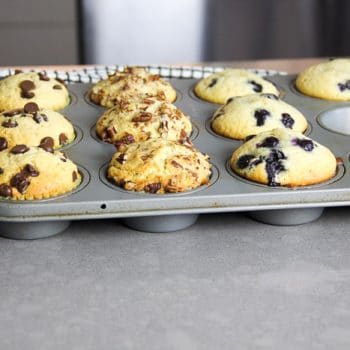 Muffins in different flavors in a muffin tin