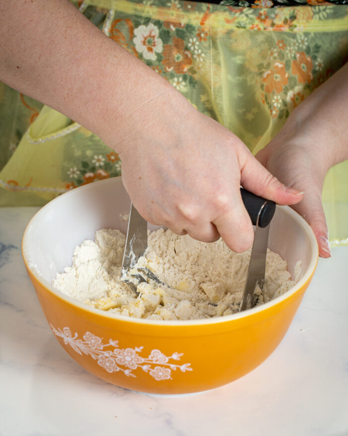 cutting butter into dry ingredients with pastry blender