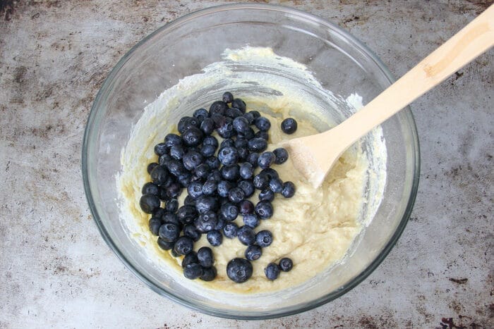 Blueberries being added to quick bread batter