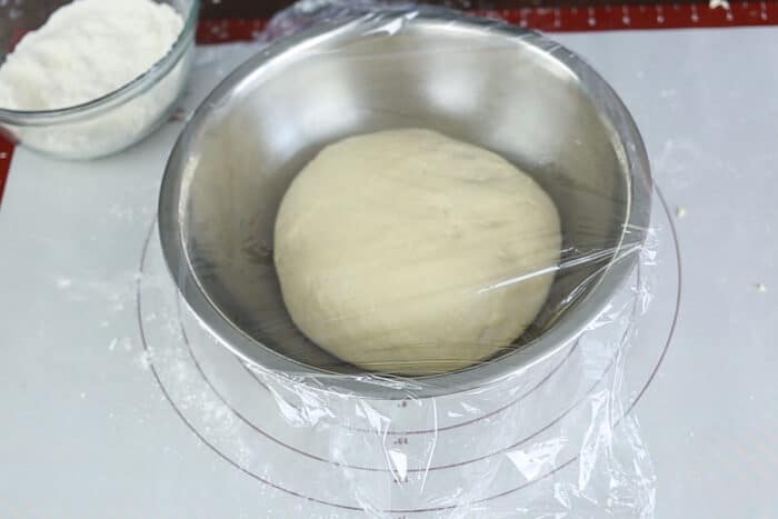 White bread dough in bowl before proofing