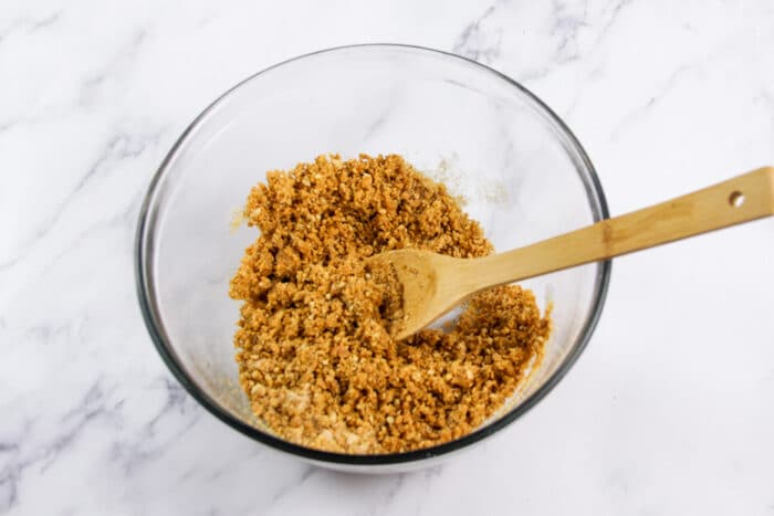 Ingredients for graham cracker crust mixed together