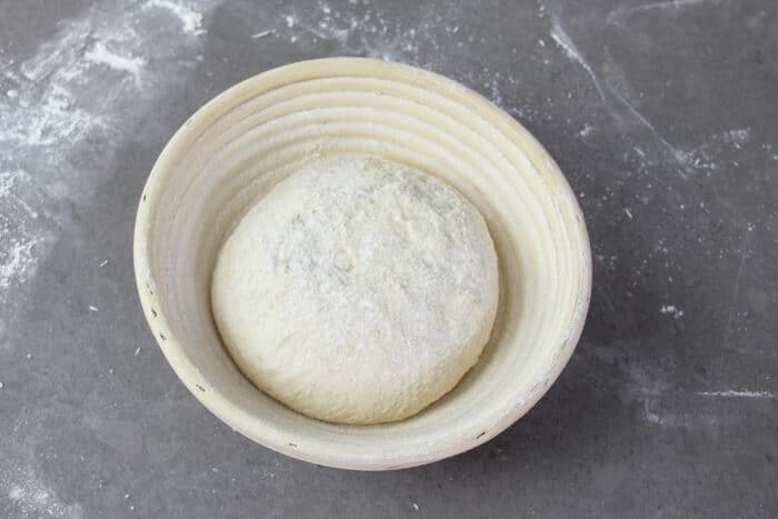 No-knead sourdough in banneton basket ready to proof