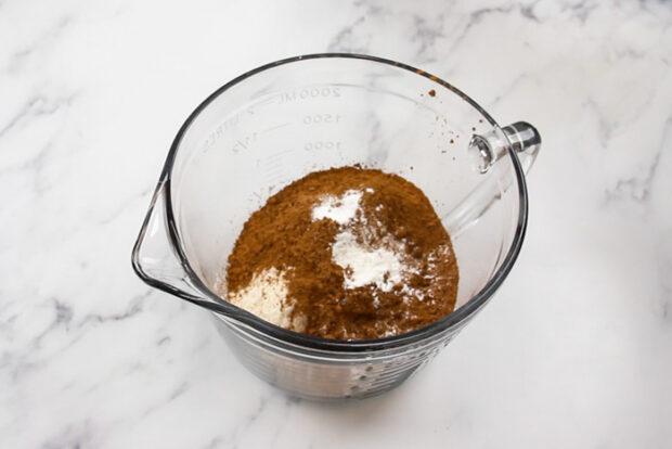 All of the dry ingredients in a mixing bowl before being whisked