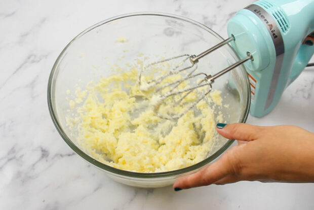 Butter and sugar in mixing bowl after being creamed together. It is light and fluffy