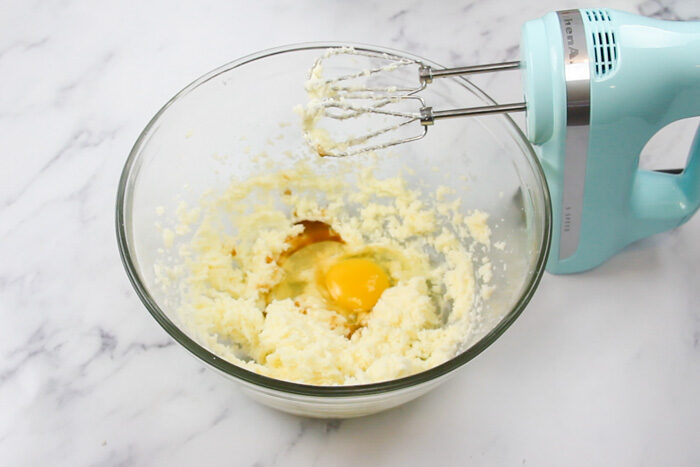 Egg and vanilla added into the mixing bowl for the chocolate whoopie pies