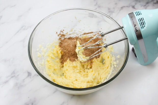 one third of the dry ingredients added into the mixing bowl with the creamed mixture