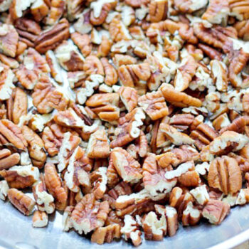 Skillet filled with pecans to be toasted