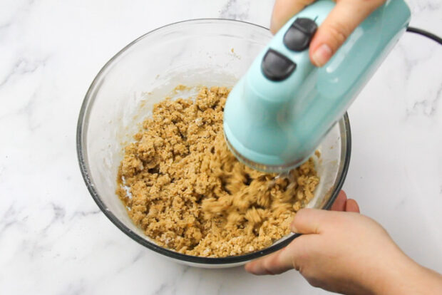 Hand mixer mixing the sweet potato cookie dough
