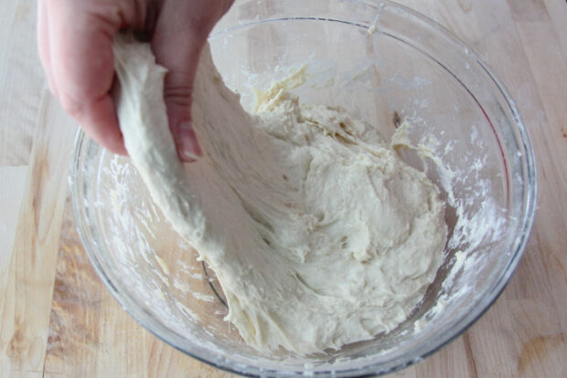 Stretching the dough by pulling up on it