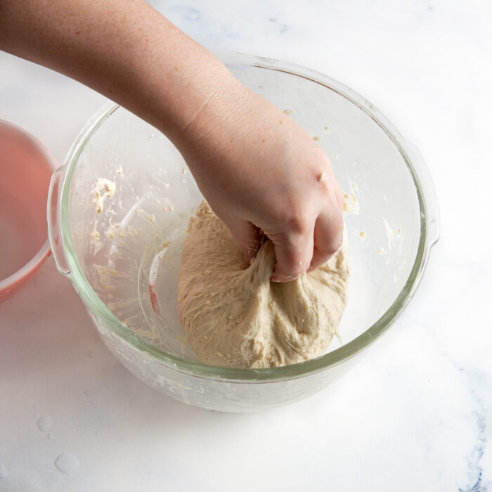 pinching the dough with fingers