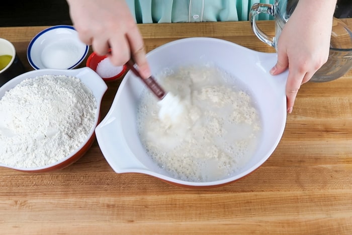 Stirring in active sourdough starter into warm water