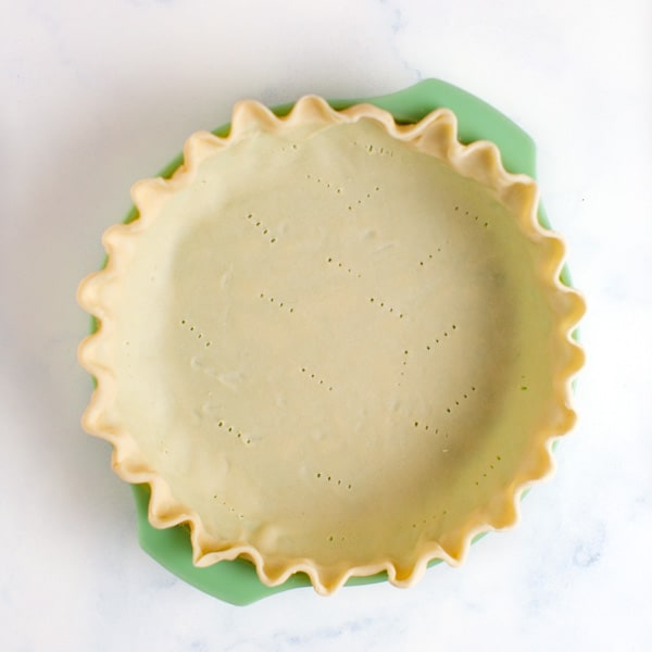 pie crust fit in pie plate that has been crimped and docked