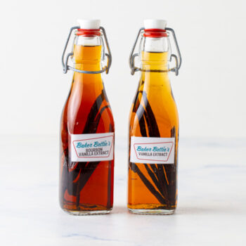 two bottles of homemade vanilla extract side by side