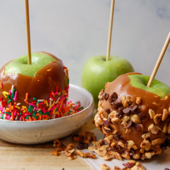 Caramel apples dipped in sprinkles, nuts and chocolate
