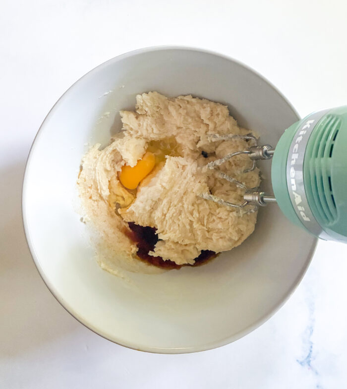adding wet ingredients to cookie dough