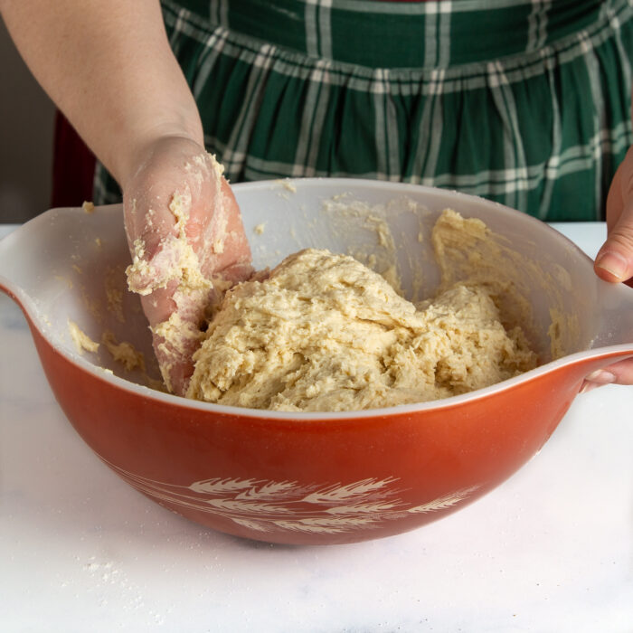 Using my hands to combine ingredients together in a bowl