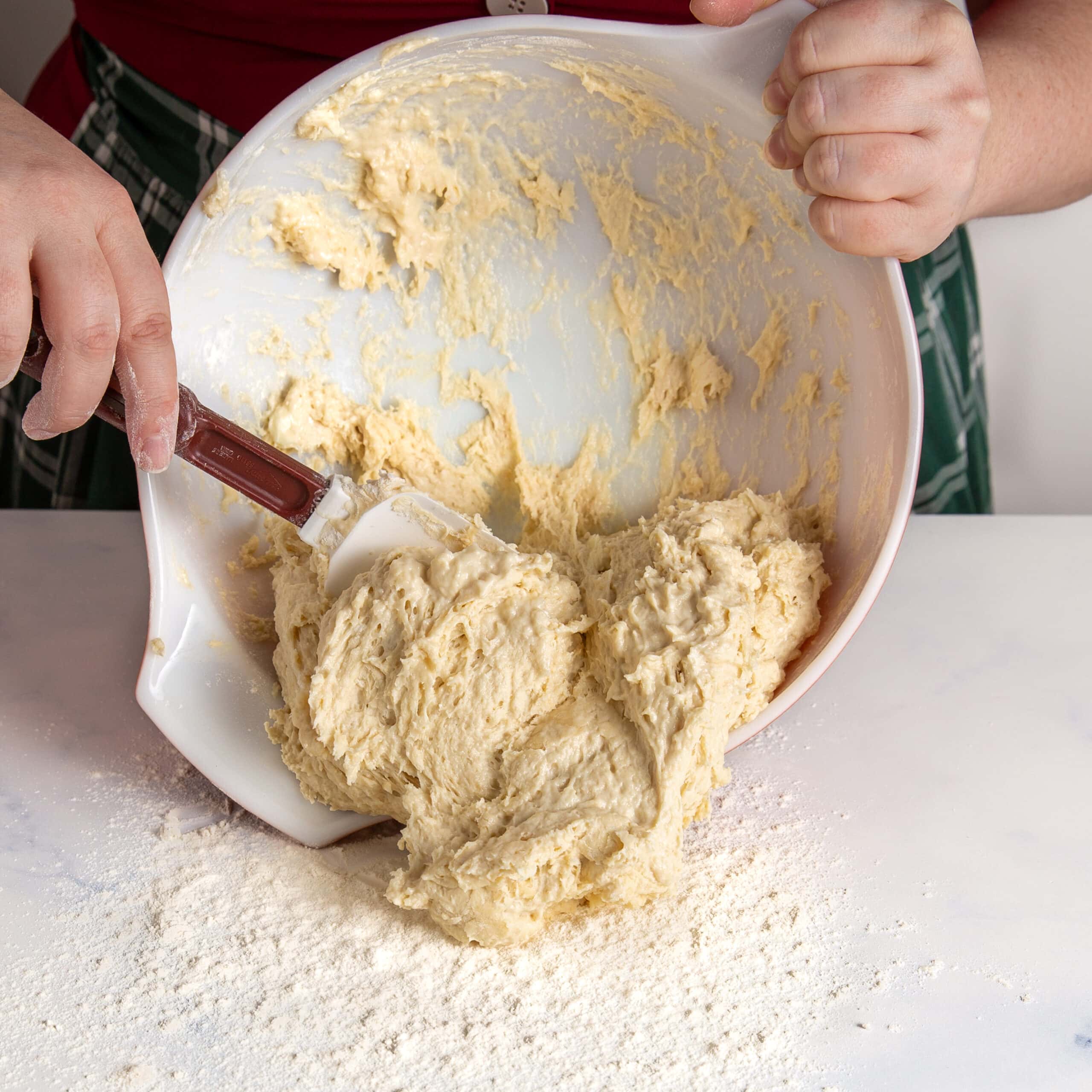 Pouring the dough out onto the counter