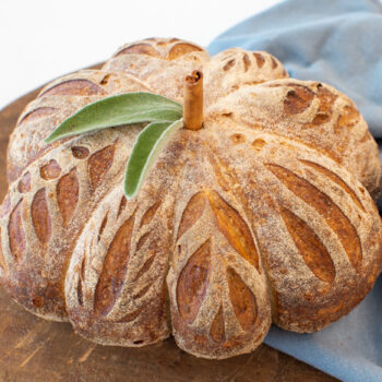 Pumpkin shaped loaf bread on a cutting board