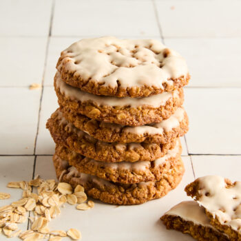 iced oatmeal cookies stacked up