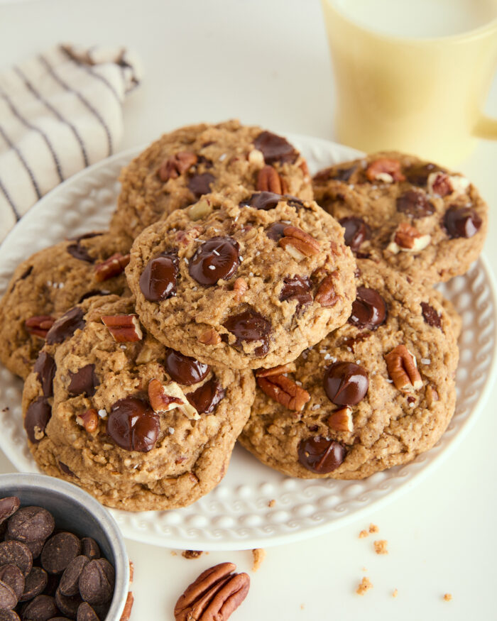 This is arguably the best ultimate chocolate chip cookies ever! The cookies are thick, and slightly crisp on the outside and incredibly chewy on the inside and made with brown butter and a good hit of flaky salt! brown butter chocolate chip cookies stacked on a plate