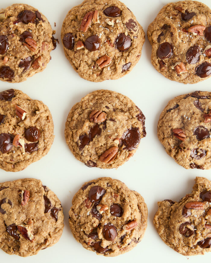 brown butter chocolate chip cookies spread out on the counter