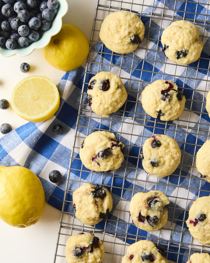 blueberry cookies on a wire rack before glazing