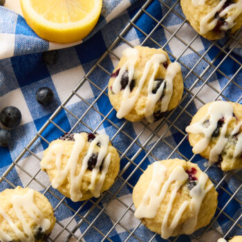 blueberry cookies with lemon glaze on a wire rack