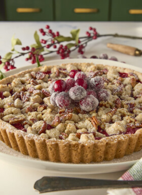 cranberry tart decorated with sugared cranberries