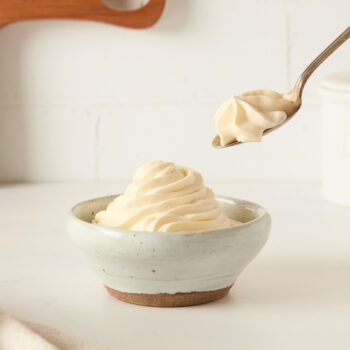 diplomat cream in a small cup and spoon