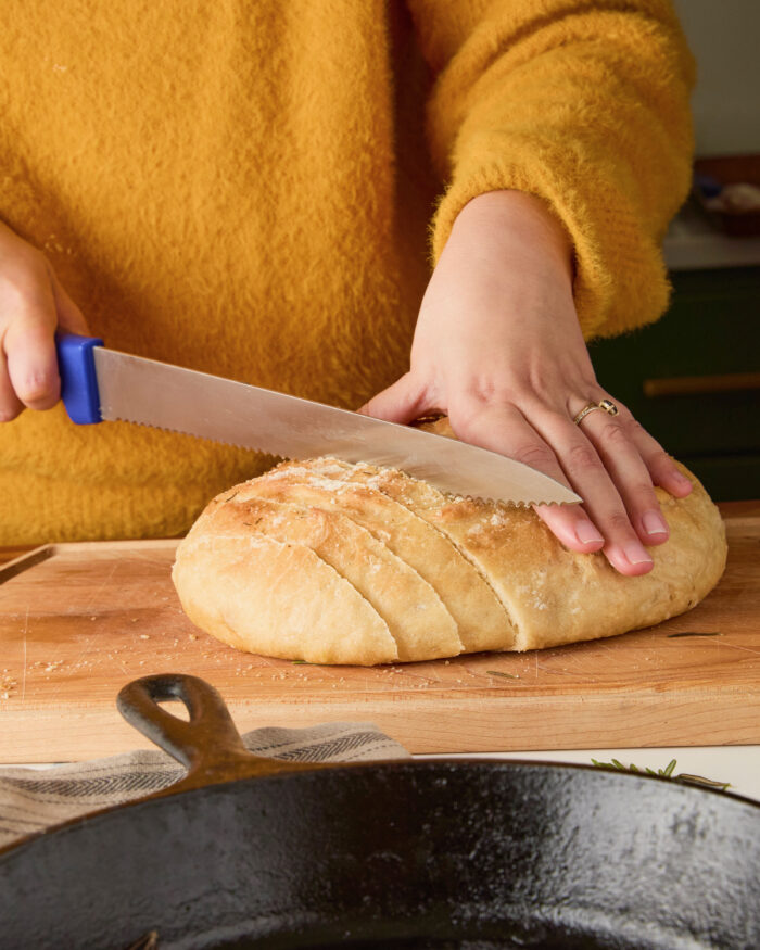 slicing skillet bread with a serrated knife